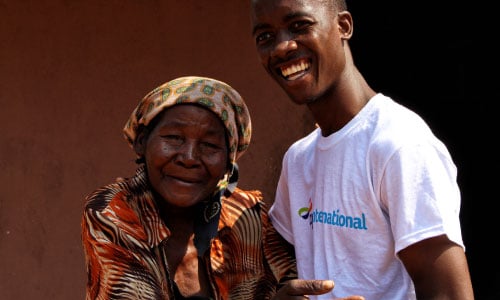 Carolina, who has dementia, poses for a photo with her carer