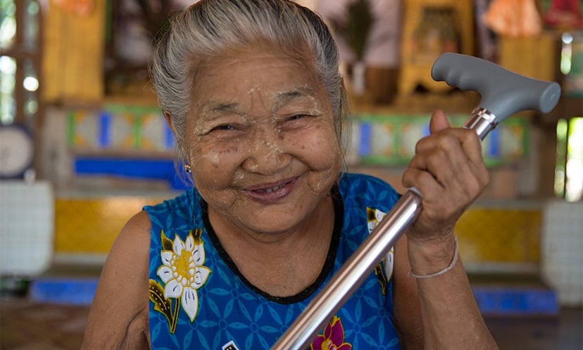 Daw Mya Ichin from Myanmar has been given a walking stick from Age International